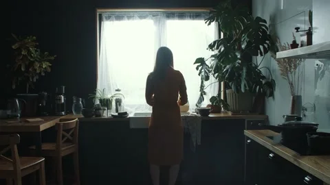 ANGER CONCEPT Rear view young angry upset back lit woman in dark room turning to Video stock 172117011