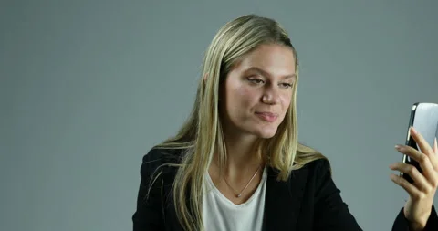 Angered by buffering, violently discards her smartphone Video stock 267573233