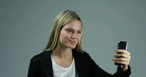 Angered by buffering, violently discards her smartphone Stock Footage 267588317