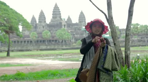 ANGKOR WAT - JUNE 2012: local seller shows her products Stock Footage 12178835