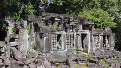 Angkor Wat, A remarkably tall building set against dense jungle backdrop Stock Footage 305382438