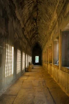Angkor wat: sunlight through the window effected on the wall Stock Photos