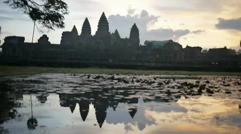 Angkor wat temple religious structure sunrise spires illuminate Stock Footage 18091756
