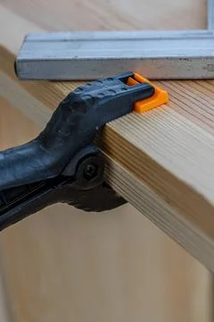 Angle and clothespin on board partial focus Stock Photos