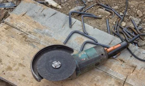 Angle grinder after cutting spacer for the rebar Stock Photos