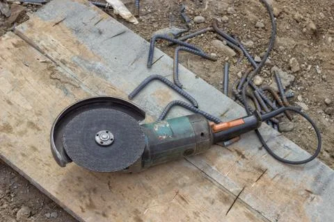 Angle grinder after cutting spacer for the rebar Stock Photos