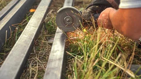 Angle grinder causing sparks. Cutting machine used to cut metal Stock Photos