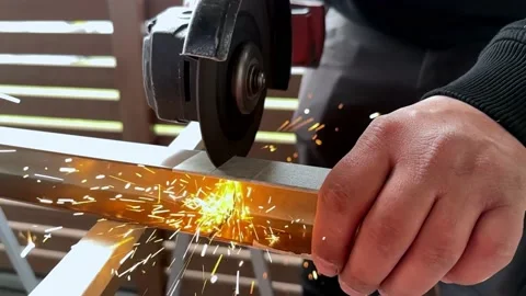 Angle Grinder Causing Sparks While Being Used to Cut Metal Video stock 235427497
