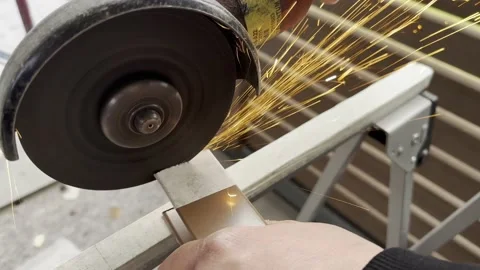 Angle Grinder Causing Sparks While Being Used to Cut Metal Stockbeeldmateriaal 236085913