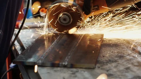 An angle grinder cuts metal. Stock Footage 167352859