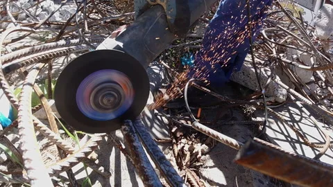 Angle grinder cuts re bar in slo motion. 스톡 동영상 172232493