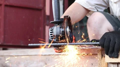 Angle grinder cuts reinforcement, close-up Stock Footage 316680992