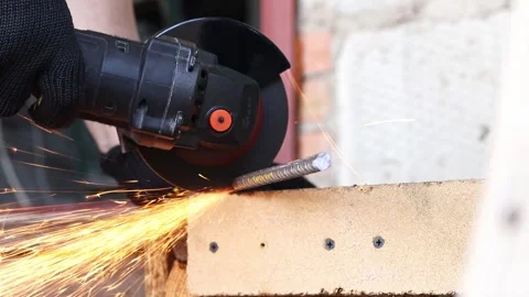 Angle grinder cuts reinforcement, sparks fly Stock Footage 316680734