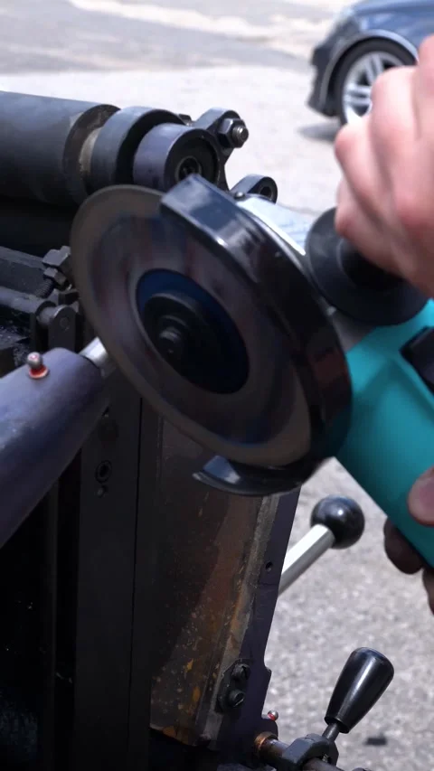 Angle grinder cutting and grinding metal with bright sparks in workshop Stock-Footage 344822576