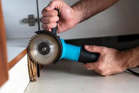 Angle Grinder Cutting Door Frame. Home Repair Action Shot Stock Photos