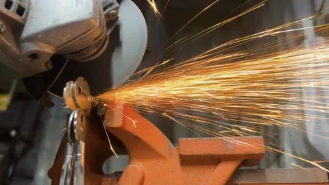 Angle Grinder Cutting Key with Sparks Flying Stock Footage 333901345