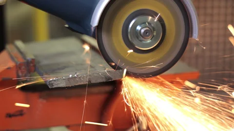 Angle grinder cutting metal with bright sparks. Close-up of an angle grinder Stock Footage 311303659