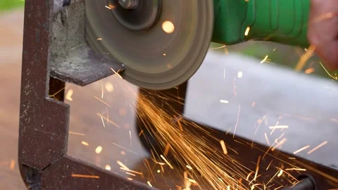 Angle grinder cutting rusty metal profile with bright sparks flying.. Stock Footage 313182291
