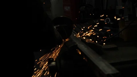 Angle Grinder cutting stainless Steel in Slowmotion 4K Stock Footage 105011665