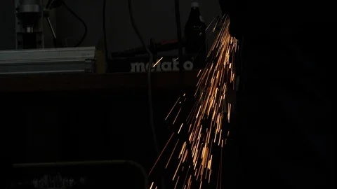 Angle Grinder cutting stainless Steel in Slowmotion 4K Stock Footage 105014175