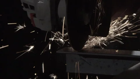 Angle grinder cutting steel channel, sparks cascading, side view (part 1) Stock Footage 346253634