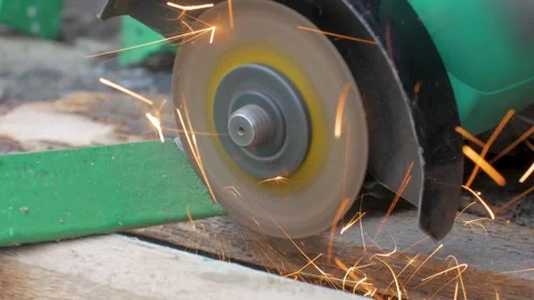 Angle grinder is cutting through a metal angle bar Stock Footage 323262525