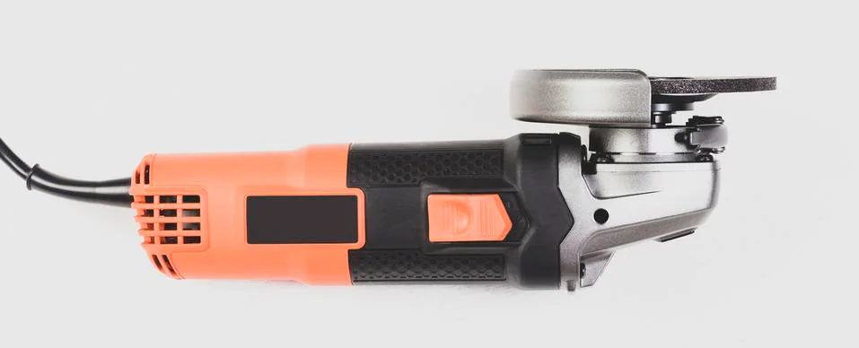 Angle grinder isolated on white background, close-up image Stock Photos