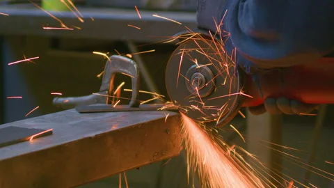 Angle grinder sparks blacksmith hand handheld close up shot Stock Footage 341339082