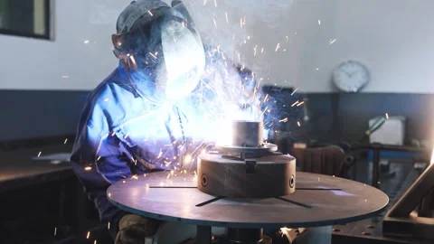 Angle Grinder Sparks Flying Toward Camera in Factory Workshop Видео 339046883