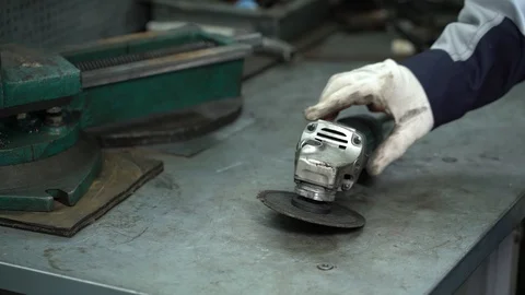 Angle grinder on the table Stock Footage 122244738