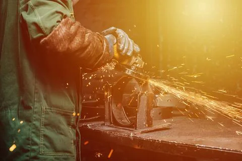 Angle grinder at work, sparks flying away in the process Stock Photos