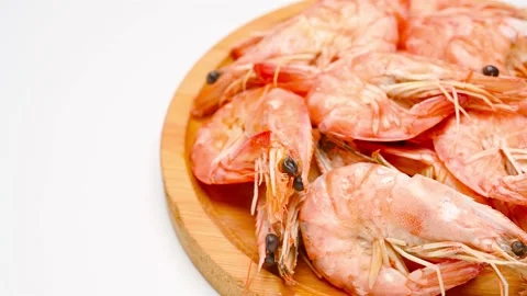 Angle pan fresh cooked shrimps on white Stock Footage 233389531