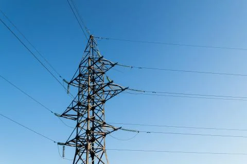 Angle of rotation of electrical wires on a high-voltage support. Stock Photos
