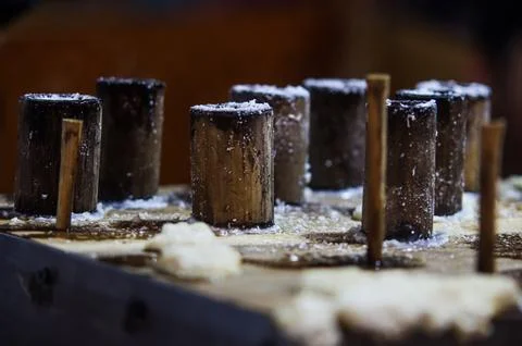 Angle View of Bamboo Tubes Mounted on Steam Holes for Making Traditional In.. Foto stock