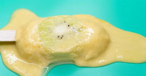 Angle view DCI standard ratio of mango and milk flavor popsicle with slice of Stock Footage 152378730