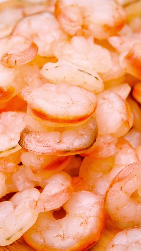 Angle view fresh cooked unskin shrimps rotating vertical composition 스톡 동영상 238045201