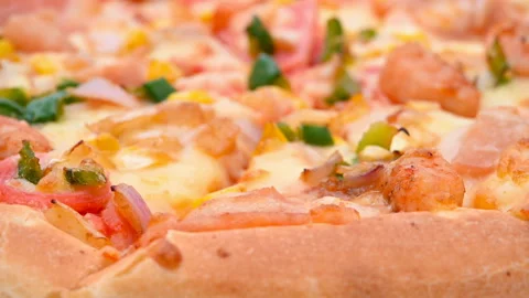 Angle view fresh pizza with shrimps and bacon toppings rotating Stock Footage 150356071
