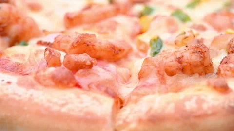 Angle view fresh pizza with shrimps and bacon toppings turning close up Stock Footage 168336477