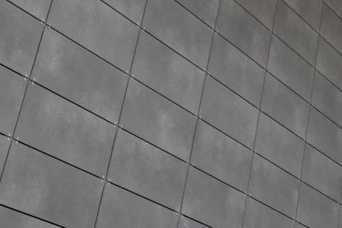 Angle view of modern just placed gray ceramic tiles with dark joint. Backdrop 스톡 사진