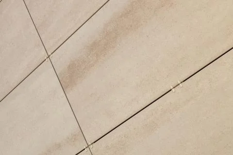 Angle view of rectangular concrete beige tiles on wall Stock Photos