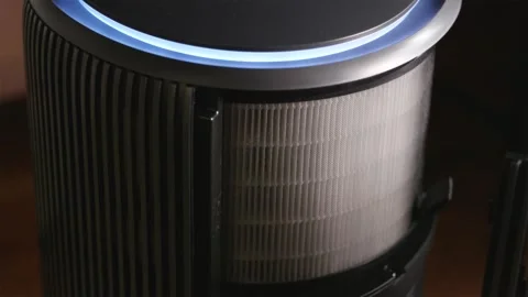 Angle view replacing paper filter in smart air purifier Stock Footage 343872495