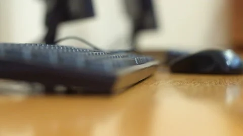Angle view from the side of a man typing on a computer keyboard Video stock 49894470
