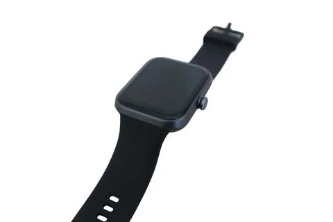 Angle view of a sleek black rectangular smartwatch with a side crown button.. Fotos Stock