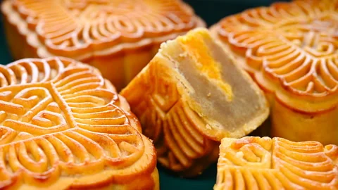 Angle view square shape traditional mooncakes with a piece cut out rotating Stock Footage 155180439