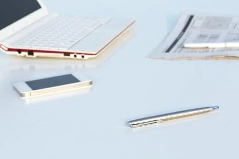 Angle View of Work Place with Laptop Telephone Pen and Business Newspaper Stock Photos