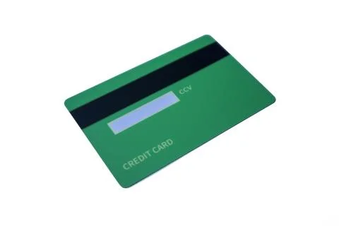 Angled back view of a green credit card with magnetic stripe and CCV panel .. Stock Photos