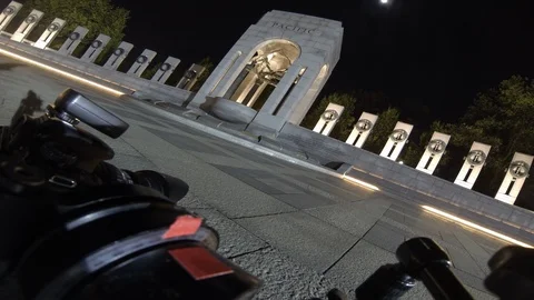 Angled behind-the-scenes time lapse shot of World War II Memorial, night Stock Footage 99181940