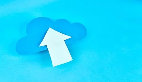 Angled blue cloud with white upload arrow on blue background for data transfer Stock-Fotos