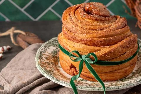 An angled close-up of a flaky puff pastry Easter bread coated in cinnamon s.. Stock Photos