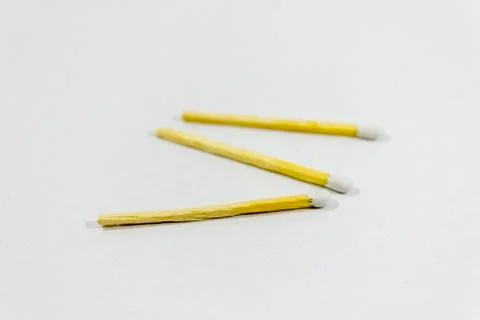 Angled close-up shot of front random spreaded multiple white match head cover Stock Photos